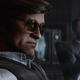 Shadowy figures from Call of Duty: Black Ops Cold War discuss conspiracies in a smoke-filled room.
